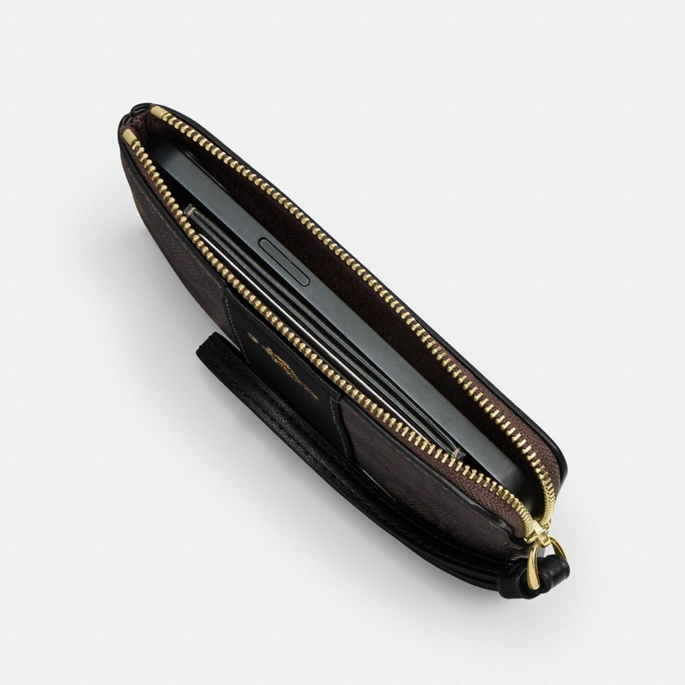 Coach Corner Zip Wristlet In Signature Canvas With Floral Print Gold Sand Multi
