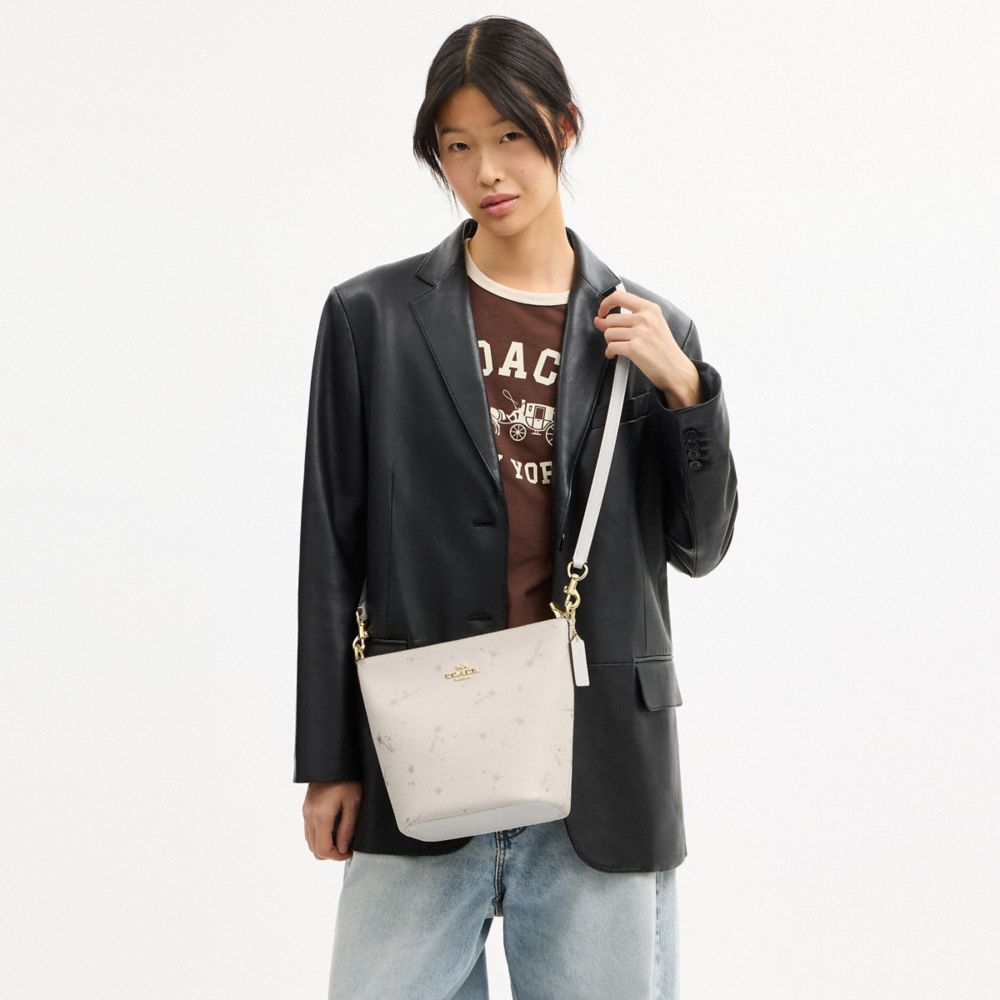 Coach Logan Duffle Bag With Star Print Gold Chalk Multi