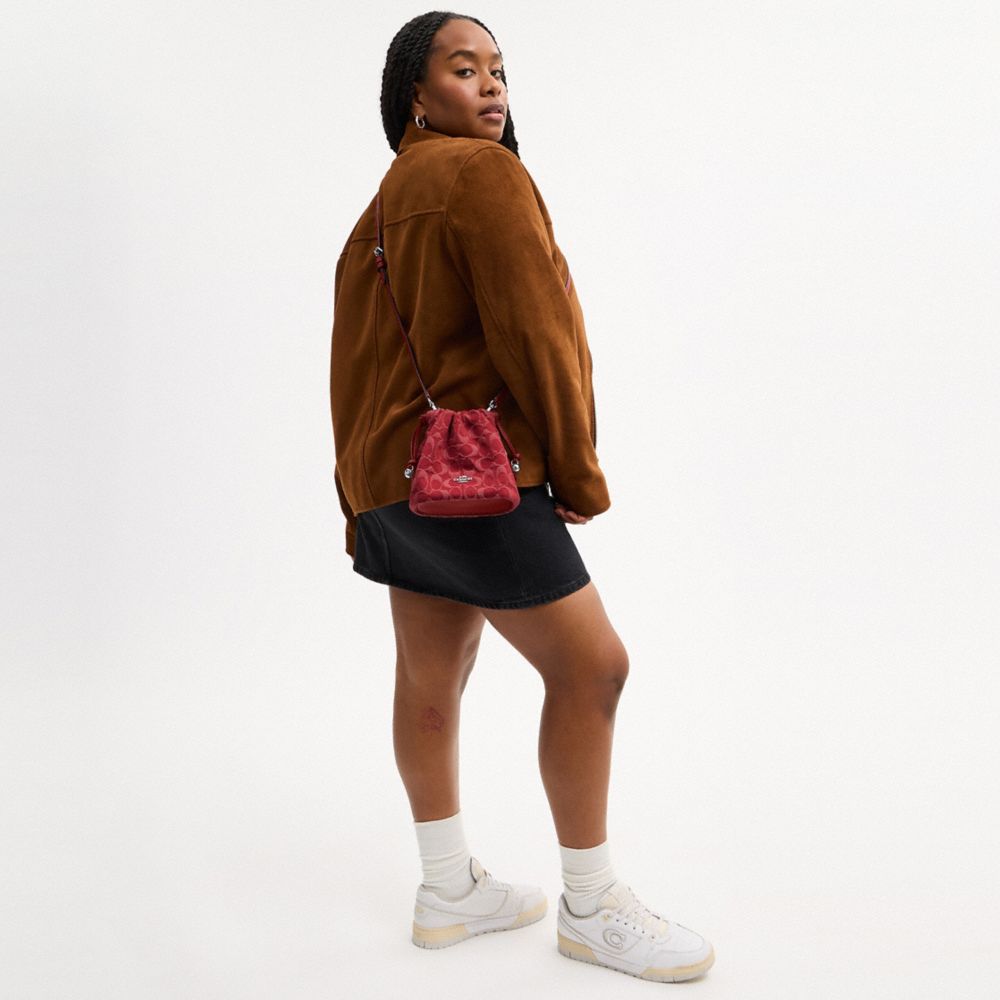 Coach Faye Mini Drawstring Bag In Signature Denim Silver True Red